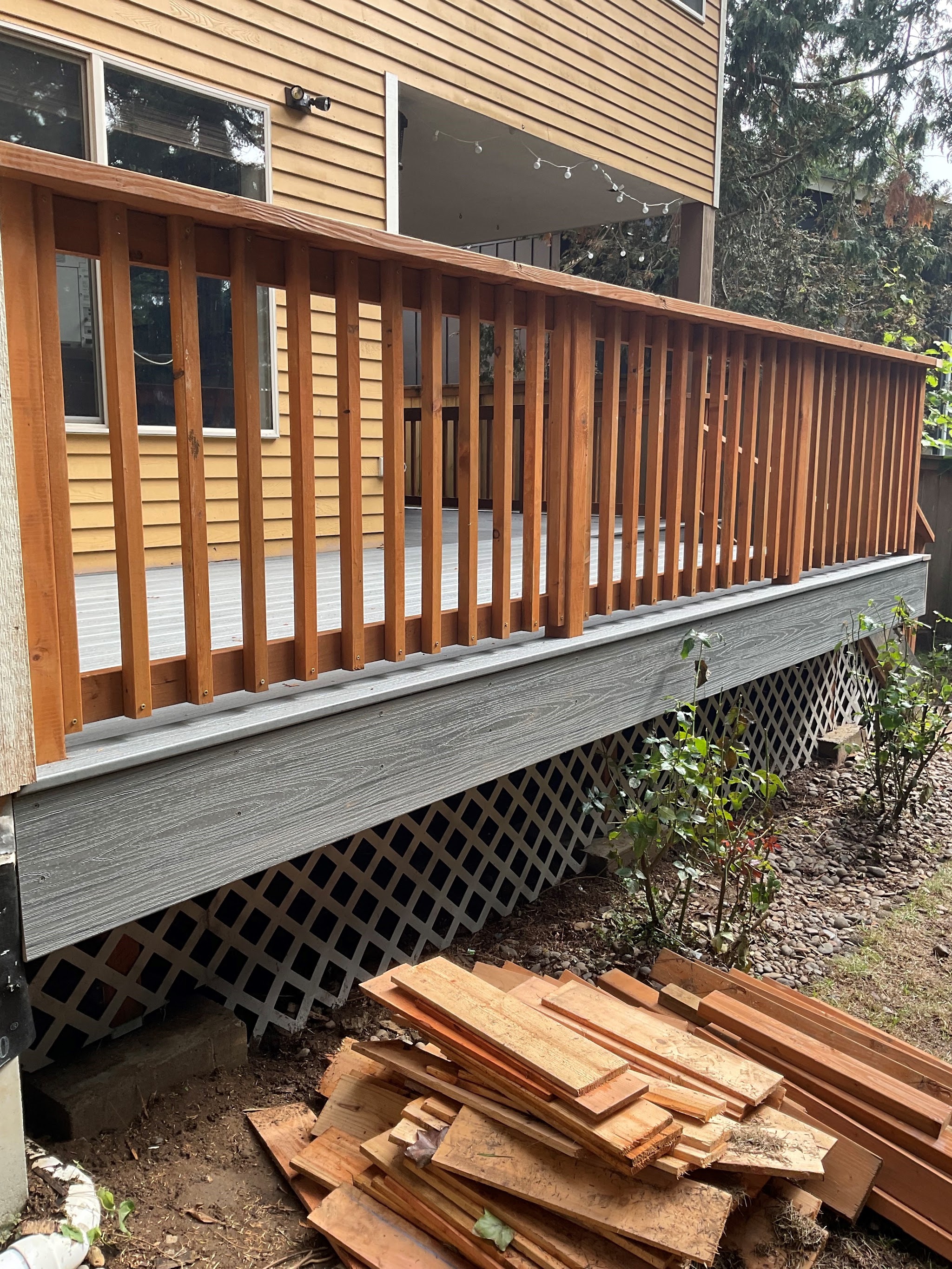 A finished deck and railing against a coastal home